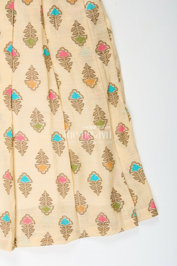 The Nesavu Girls Cotton Frock Girls cream frock with leaf block print and chevron stripes Nesavu Nesavu girls cream cotton frock with leaf print and chevron stripe bodice