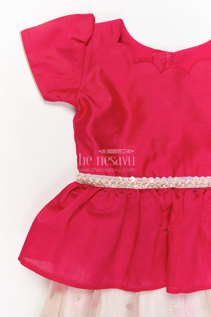 The Nesavu Pattu Pavadai Baby Girl Pattu Pavadai with Floral Print Skirt for Festive Moments Nesavu Nesavu baby girl pattu pavadai with floral tissue print skirt and semi raw silk blouse for festive occasions