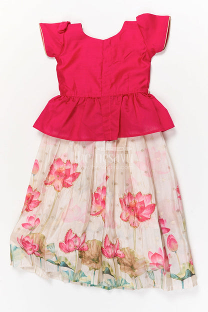 The Nesavu Pattu Pavadai Baby Girl Pattu Pavadai with Floral Print Skirt for Festive Moments Nesavu Nesavu baby girl pattu pavadai with floral tissue print skirt and semi raw silk blouse for festive occasions