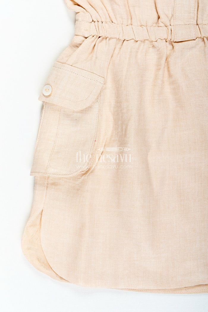 The Nesavu Girls Cotton Frock Beige girls cotton frock with collar and crochet flower patch Nesavu Nesavu beige girls cotton frock with collar and hand-crochet flower patch