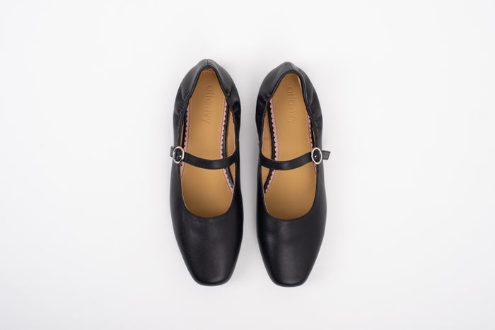 Aerial shot of large sized black leather Mary Jane flat shoe in womens sizes 8 9 10 11 12