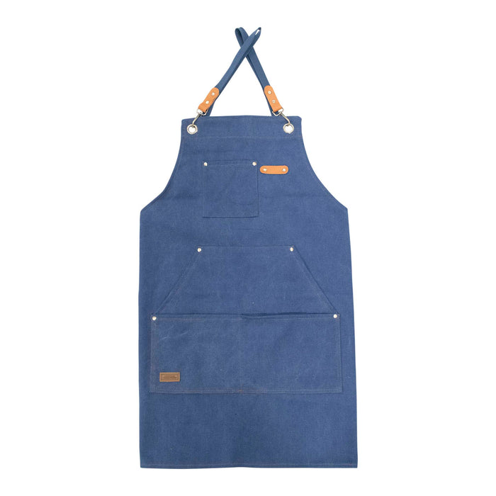 Canvas utility apron in navy waxed cotton on white background