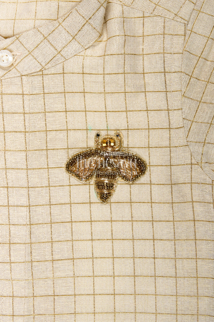 The Nesavu Boys Silk Shirt Cream Colour Shirt Boys with Gold Embroidered Bee Motif and Subtle Check Pattern in Silk Blend Fabric Nesavu Nesavu Cream Colour Shirt Boys Gold Check Pattern Embroidered Bee Motif Silk Blend