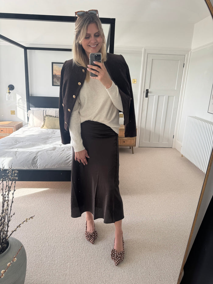 Laura modelling brown polka dot bow slingback heel available in sizes 42 43 44 45 46
