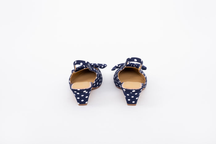 Back shot of navy polka dot kitten heeled slingback shoe in lwomens arger sizes 8-12