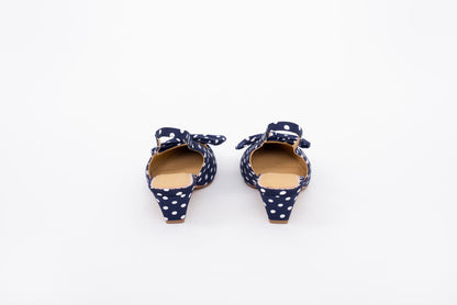 Back shot of navy polka dot kitten heeled slingback shoe in lwomens arger sizes 8-12