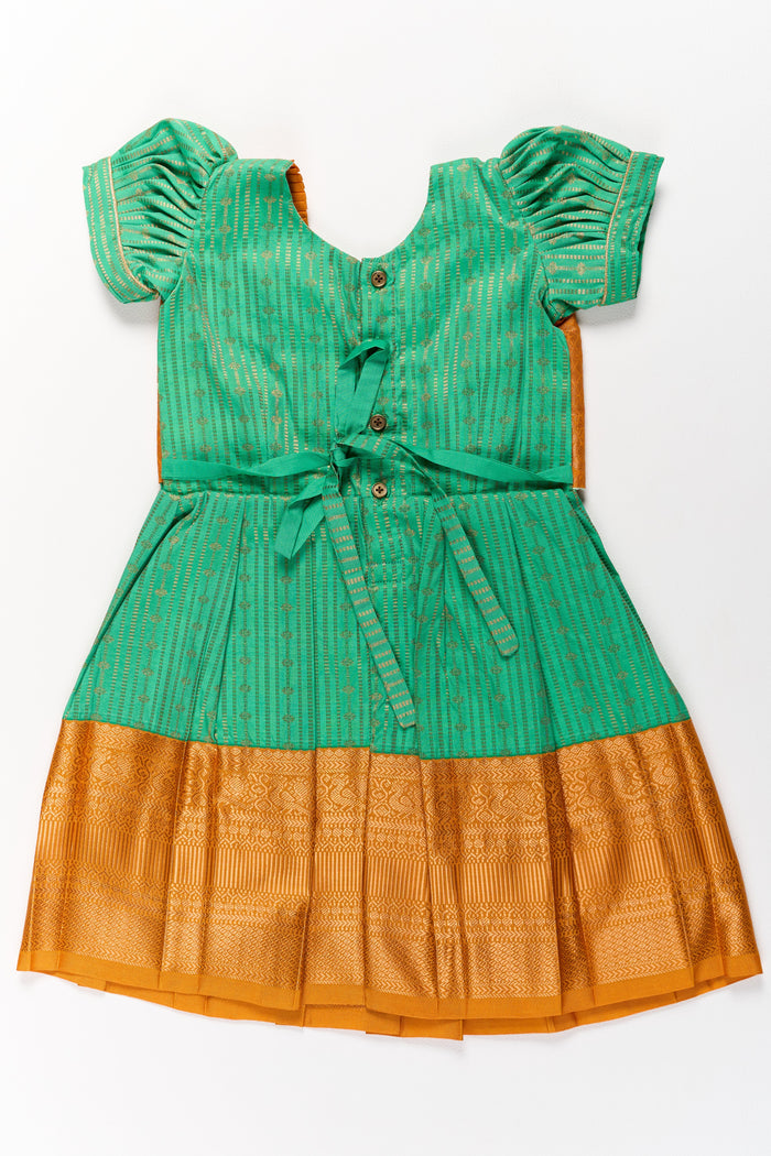 The Nesavu Girls Kanchi Silk Frock Elegant Green and Gold Pattu Full Frock for Girls with Traditional Zari Weaving Nesavu Nesavu Elegant Green Gold Pattu Full Frock Girls Traditional Zari Weaving