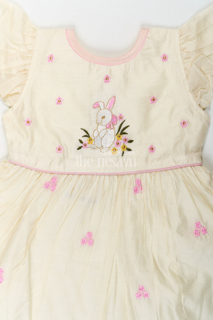 The Nesavu Girls Chanderi Frock Girls Animal Print Ruffle Dress in Chanderi with Thread Embroidery and Pink Floral Accents Nesavu Nesavu Girls Animal Print Ruffle Dress Chanderi Bunny Motif Floral Embroidery
