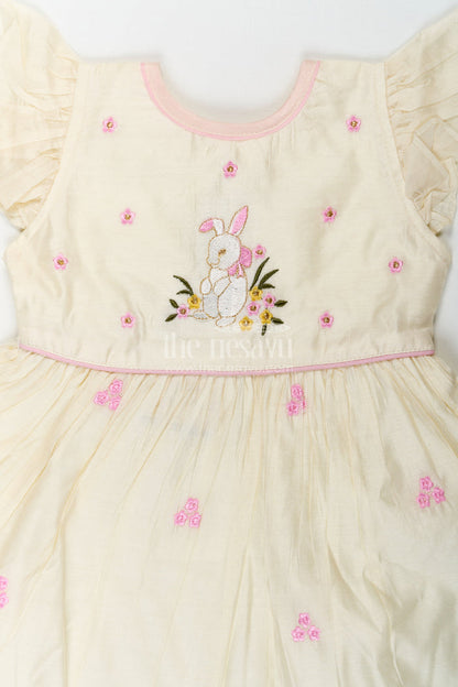 The Nesavu Girls Chanderi Frock Girls Animal Print Ruffle Dress in Chanderi with Thread Embroidery and Pink Floral Accents Nesavu Nesavu Girls Animal Print Ruffle Dress Chanderi Bunny Motif Floral Embroidery