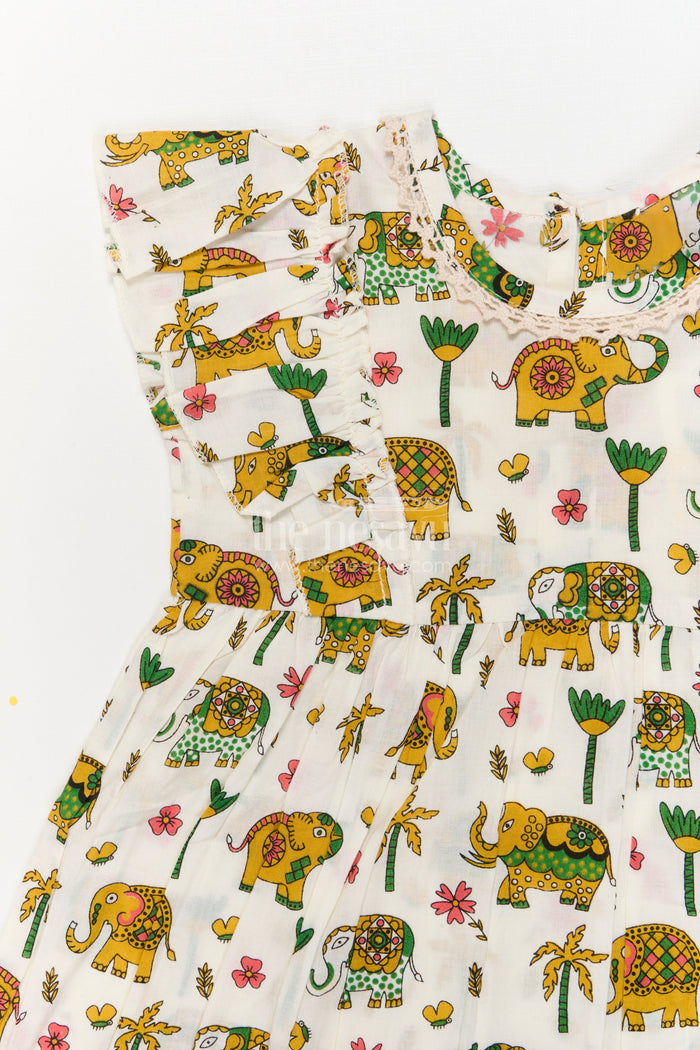 The Nesavu Girls Cotton Frock Girls Cotton Frock with Elephant Print for Zoo Visits and Playful Days Nesavu Nesavu cotton frock for girls with multicolor elephant print and flutter sleeves – ideal for playful days