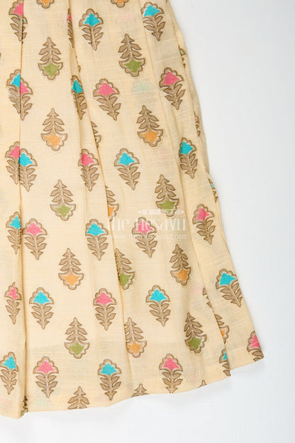 The Nesavu Girls Cotton Frock Girls cream frock with leaf block print and chevron stripes Nesavu Nesavu girls cream cotton frock with leaf print and chevron stripe bodice