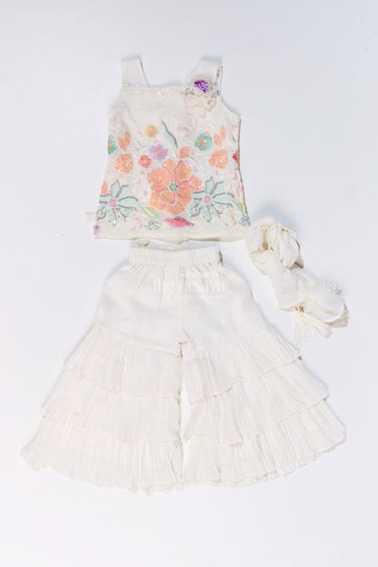 The Nesavu Girls Sharara / Plazo Set Girls Off White Sharara with Floral Embroidered Top and Layered Ruffle Pants Nesavu Nesavu Girls Off White Sharara Floral Embroidered Top Layered Ruffle Pants