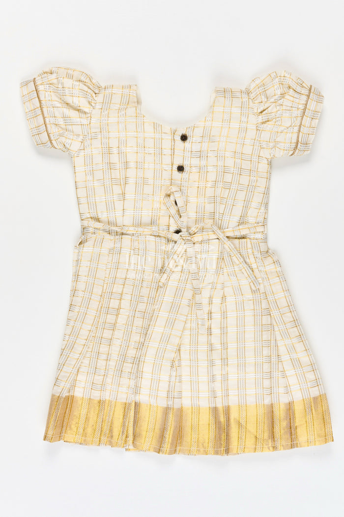 The Nesavu Silk Frock Girls Short Frocks for Party in Beige Silk with Gold Bow Embellishment and Checked Pleated Design Nesavu Nesavu Girls Short Frocks Party Beige Silk Gold Checked Pleats Bow Embellishment