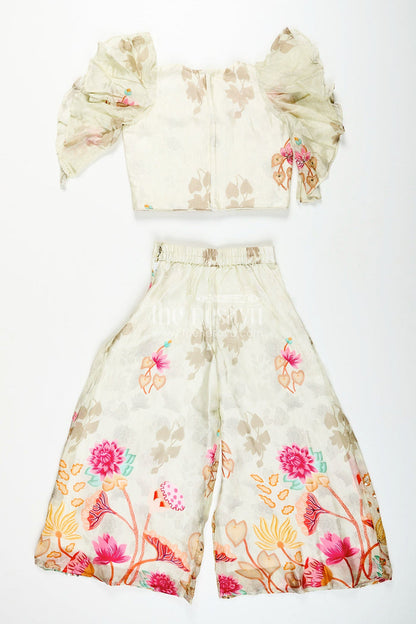 The Nesavu Girls white floral sharara set with puff sleeve blouse for birthdays and events Nesavu Nesavu girls white floral printed sharara set puff sleeve top  perfect festive birthdays family functions