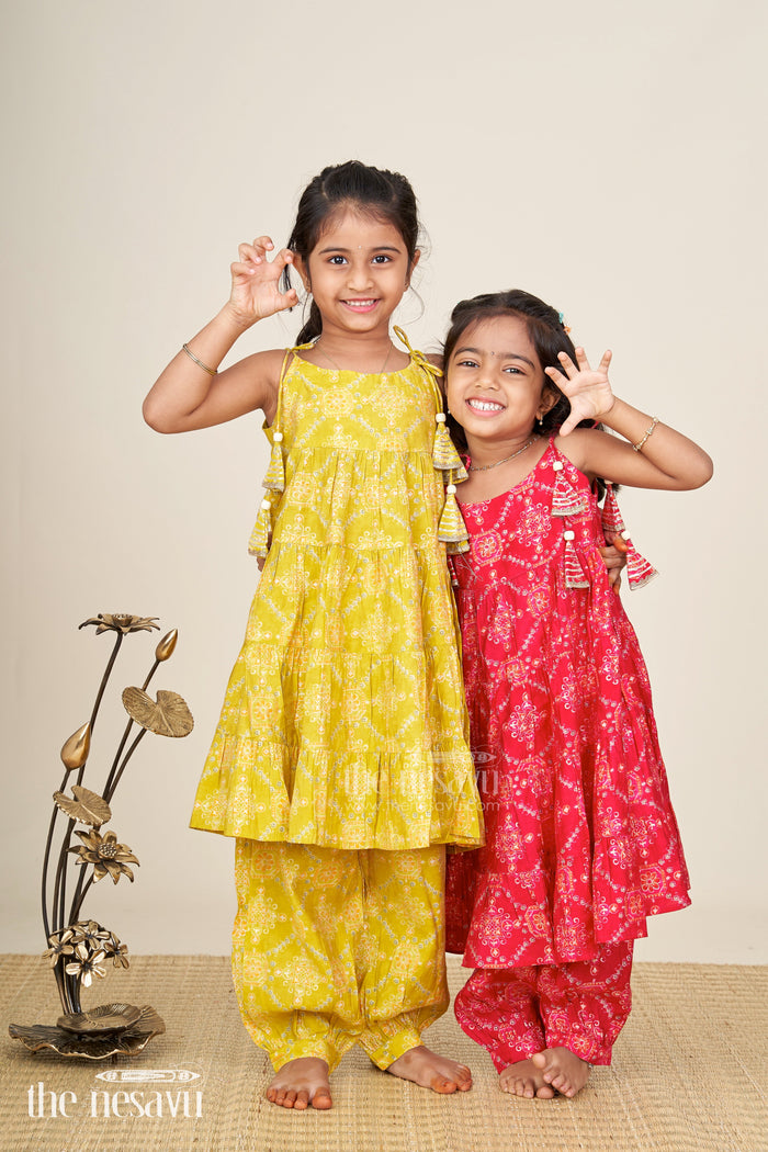 The Nesavu Girls Sharara / Plazo Set Girls yellow sharara set with printed tiered kurti for festive dressing Nesavu Nesavu girls yellow cotton sharara set with tiered flared kurti and digital print for festive wear