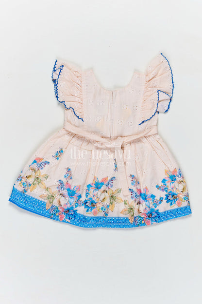 The Nesavu Baby Cotton Frocks Infant Occasion Dress for Baby Girl in Cream Hakoba Cotton with Blue Floral Hem and Ruffled Sleeves Nesavu Nesavu Infant Occasion Cotton Frock Baby Girl Blue Floral Print Ruffle Sleeves Hakoba Fabric