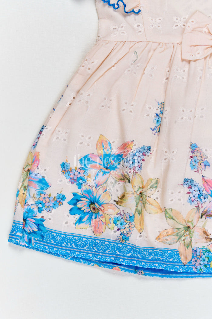 The Nesavu Baby Cotton Frocks Infant Occasion Dress for Baby Girl in Cream Hakoba Cotton with Blue Floral Hem and Ruffled Sleeves Nesavu Nesavu Infant Occasion Cotton Frock Baby Girl Blue Floral Print Ruffle Sleeves Hakoba Fabric