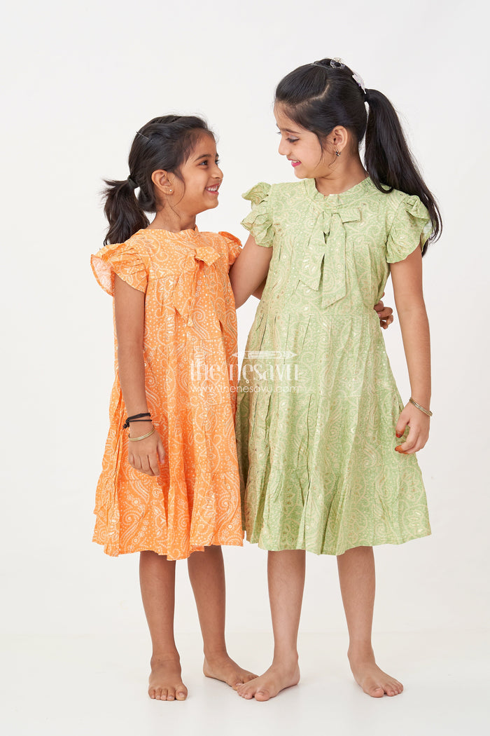The Nesavu Girls Cotton Frock Nesavu Casual Cotton Frocks for Girls in Rayon with Orange Bandhani Print and Gold Foil Details Nesavu Nesavu Casual Cotton Frocks Girls Rayon Orange Bandhani Print Gold Foil Details