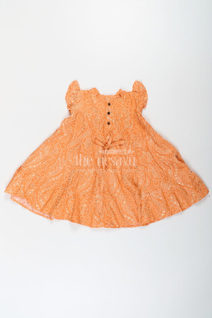 The Nesavu Girls Cotton Frock Nesavu Casual Cotton Frocks for Girls in Rayon with Orange Bandhani Print and Gold Foil Details Nesavu Nesavu Casual Cotton Frocks Girls Rayon Orange Bandhani Print Gold Foil Details