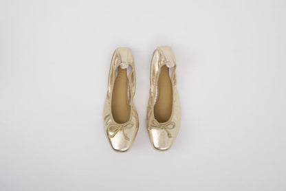 Aerial shot of womens gold ballet flats in large sizes 8 9 10 11 12