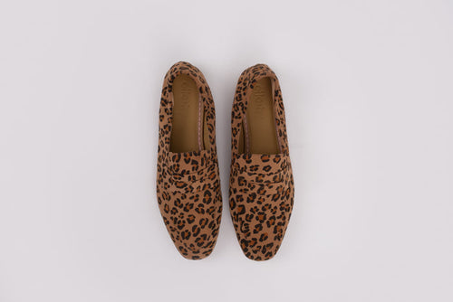 Large sized womens Pair of leopard print loafers on a white background 8-12