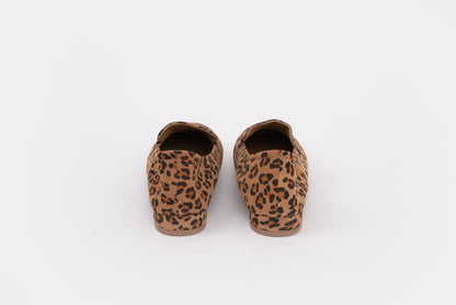 Back shot of womens size 9 large sized Pair of leopard print slippers on a white background