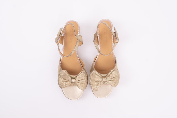 Aerial view of Rhian Sandal in Gold. A scrappy womens heel with bow detail available in larger European sizes 42-46