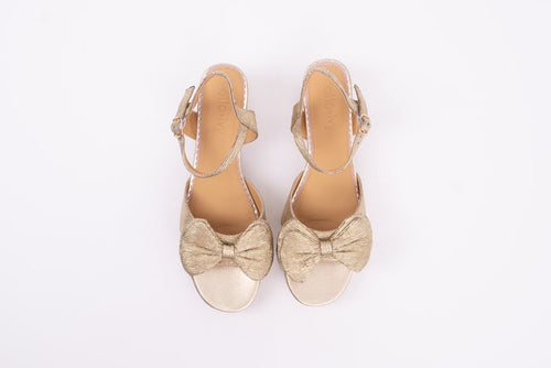 Aerial view of Rhian Sandal in Gold. A scrappy womens heel with bow detail available in larger European sizes 42-46