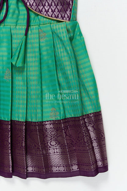 The Nesavu Girls Kanchi Silk Frock Temple Wear Silk Frock for Toddler Girls with Kanchivaram Saree Inspired Zari Border Nesavu Nesavu toddler girl temple wear silk frock with Kanchivaram style zari borders and contrast jacquard yoke