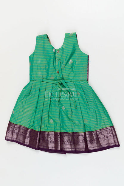 The Nesavu Girls Kanchi Silk Frock Temple Wear Silk Frock for Toddler Girls with Kanchivaram Saree Inspired Zari Border Nesavu Nesavu toddler girl temple wear silk frock with Kanchivaram style zari borders and contrast jacquard yoke