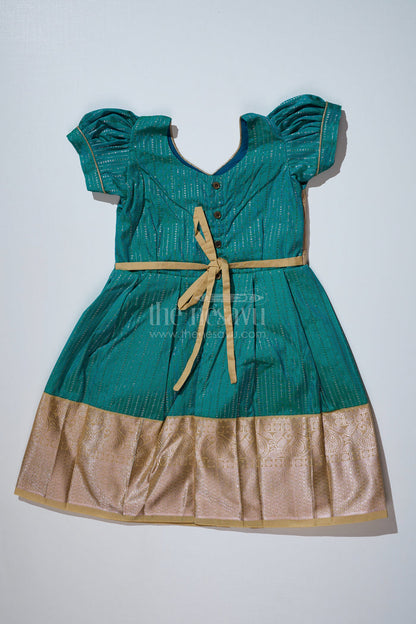 The Nesavu Girls Kanchi Silk Frock Traditional Dark Green Silk Dress for Girls with Kanchipuram Inspired Fabric and Gold Zari Border Nesavu Nesavu Dark Green Silk Dress Girls Kanchipuram Inspired Fabric Gold Zari Border