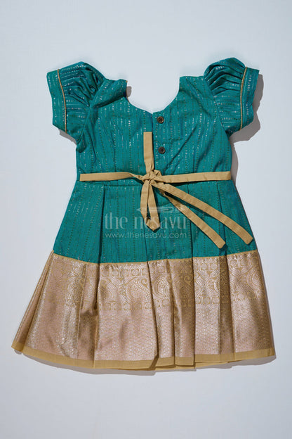 The Nesavu Girls Kanchi Silk Frock Traditional Dark Green Silk Dress for Girls with Kanchipuram Inspired Fabric and Gold Zari Border Nesavu Dark Green Silk Dress Girls Kanchipuram Inspired Fabric Gold Zari Border | The Nesavu