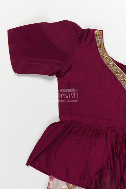 The Nesavu Pattu Pavadai Traditional Wrap-style Baby Pattu Pavadai for Festive Milestones Nesavu Nesavu wrap-style baby pattu pavadai with jungle print skirt for traditional festivities