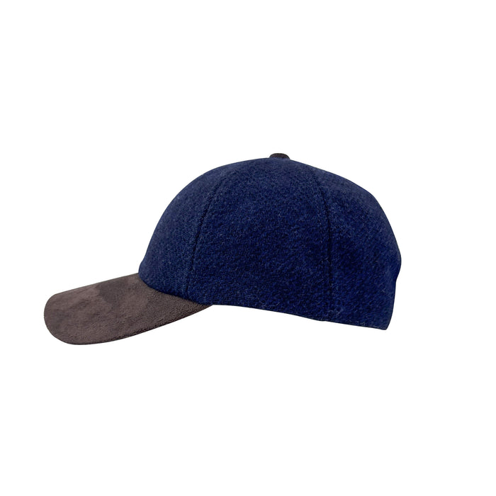 Side view of a navy baseball cap on a white background
